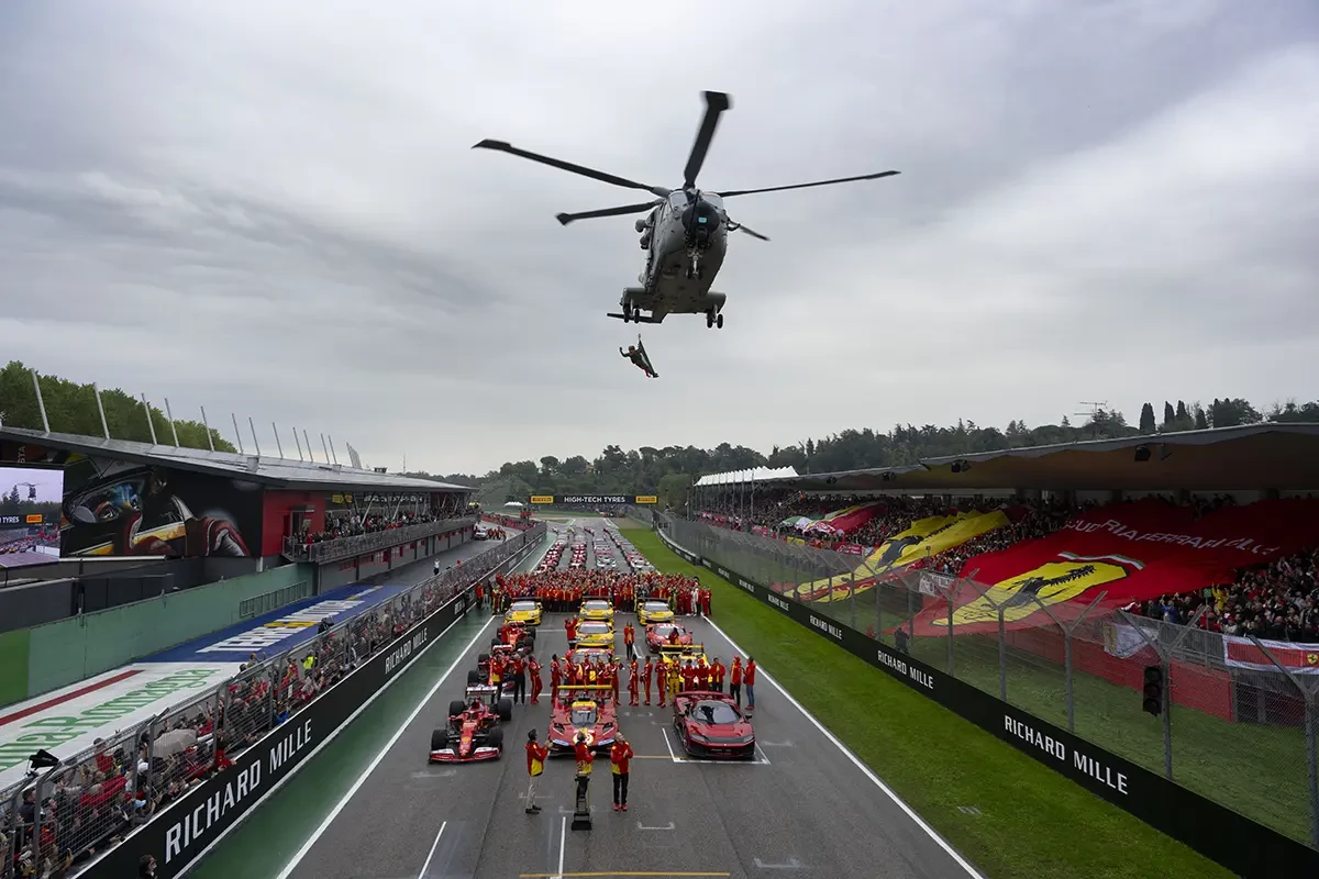 A helicopter above the Ferrari team