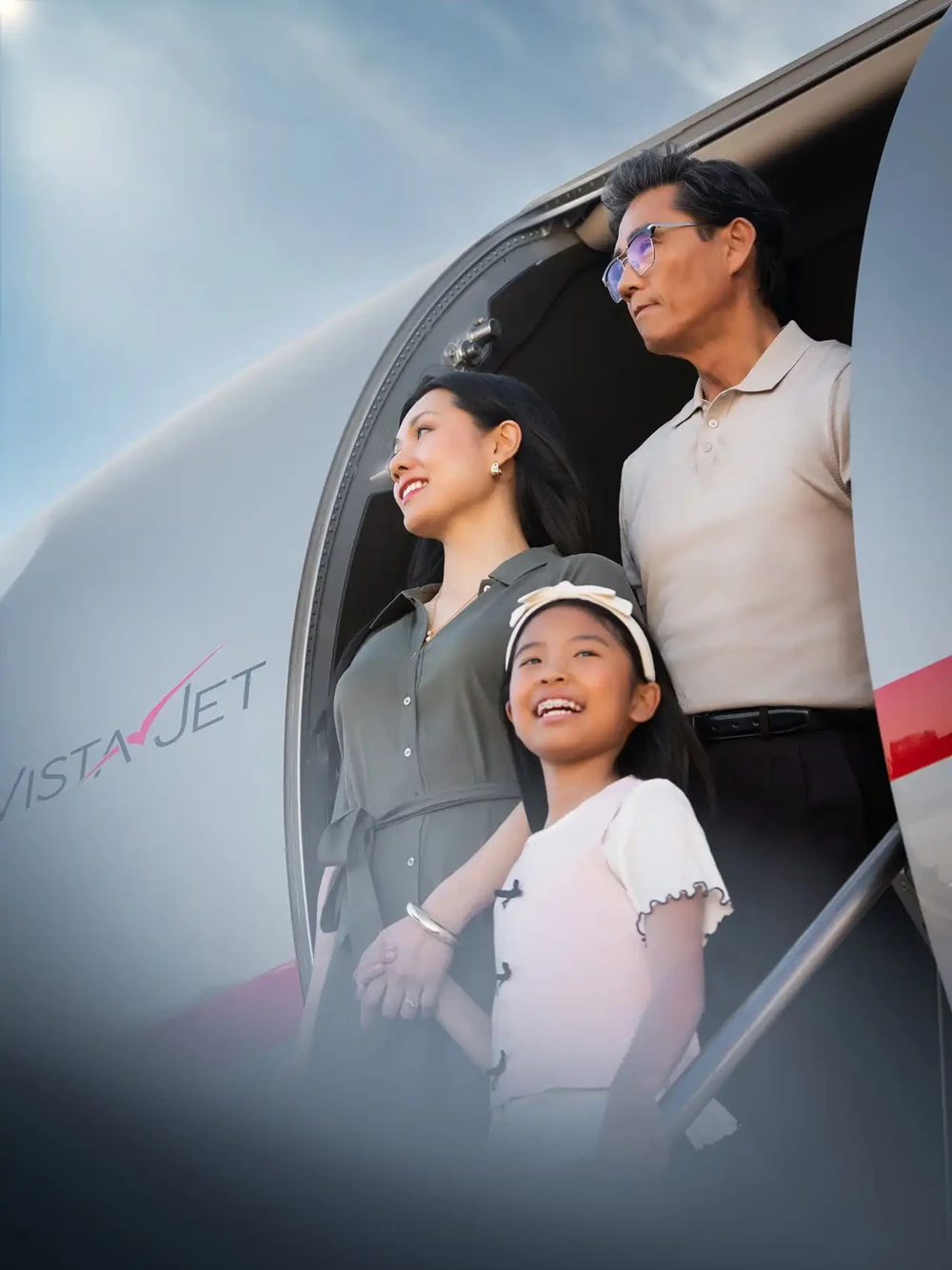 a family landing at there destination on a VistaJet fleet