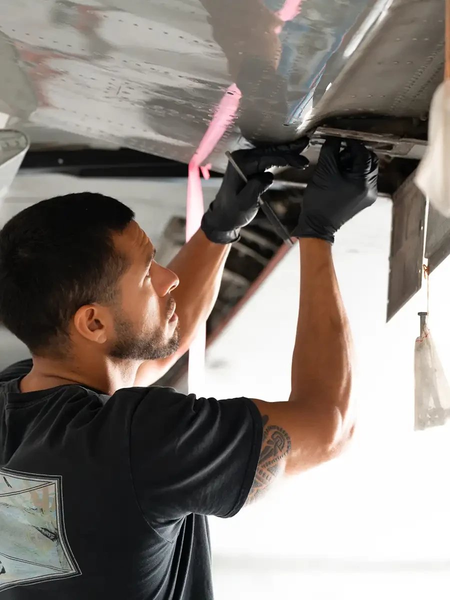 A engineer working on one of the VistaJet fleet to make sure it's safe to fly